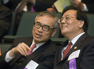 Lawrence J. Lau (left), president of the Chinese University of Hong Kong, shares a laugh with Shenghong Wang, president of Fudan University, during the Presidents Forum May 5.