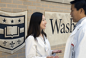 Leana Wen speaks with fellow medical student Kao-Ping Chua. Wen's essay was selected from among 2,000 entries as the winner of a contest to accompany a Pulitzer Prize-winner to Africa.