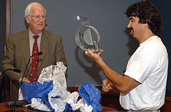 Larry J. Shapiro, M.D., executive vice chancellor for medical affairs and dean of the School of Medicine, presents the Dean's Distinguished Service Award to Jerome Pinkner, research lab manager in the Department of Molecular Microbiology. The award annually recognizes an employee whose outstanding contributions exemplify an exceptional commitment and dedication to the School of Medicine.