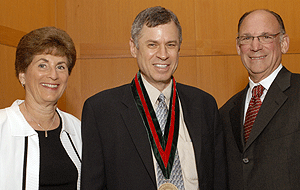 Larry A. Taber, Ph.D., is flanked by Barbara and Dennis Kessler upon his installation as the first Dennis and Barbara Kessler Professor of Biomedical Engineering in the School of Engineering.