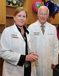 Mary Hoffmann receives the Deans Research Support Award from Larry J. Shapiro, M.D.