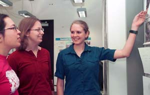 Griggs, right, explains some of her research