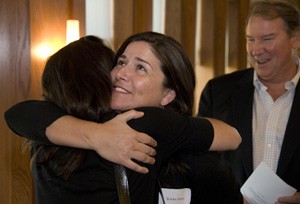 Brooke B. James (center), an MBA student in Olin Business School, accepts congratulations for winning the Community Service Individual Award during the Graduate Professional Council’s 2011-12 Bridging GAPS awards ceremony, held April 9 in the Danforth University Center. At right is her father, Bill James.