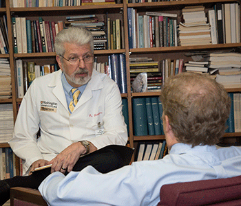 C. Robert Cloninger, MD, PhD, pictured in his office at Washington University School of Medicine, is a senior investigator of a study that shows that schizophrenia isn't a single disease but a group of eight genetically distinct disorders.