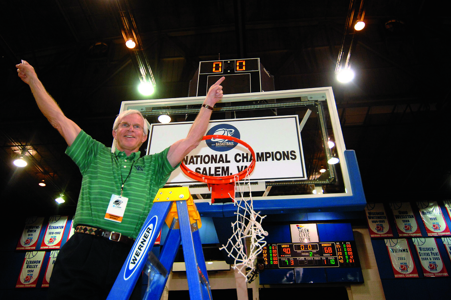 John Schael, former director of athletics, getting the game net after the Bears win the national championship in Salem, VA.