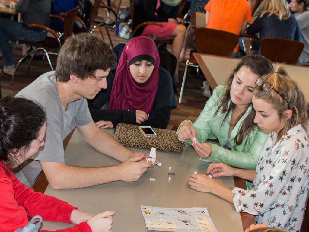 To foster collaboration and teamwork in health care, three institutions – the Goldfarb School of Nursing at Barnes-Jewish College, St. Louis College of Pharmacy and Washington University School of Medicine – have created the Center for Interprofessional Education (CIPE) at Washington University Medical Center. Shown are students from each of the schools as they participate in a team-building exercise. (Photo: Allison Braun)