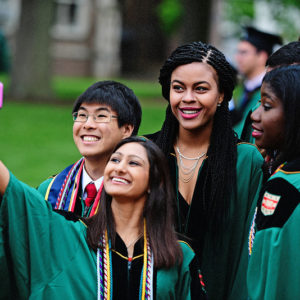 Students take a selfie at Commencement