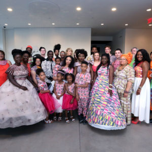 group of people in dresses