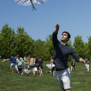 student flying a kite