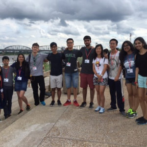 students pose in front of Mississippi River