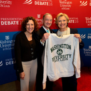 Wrightons and Hillary Clinton pose with a sweatshirt