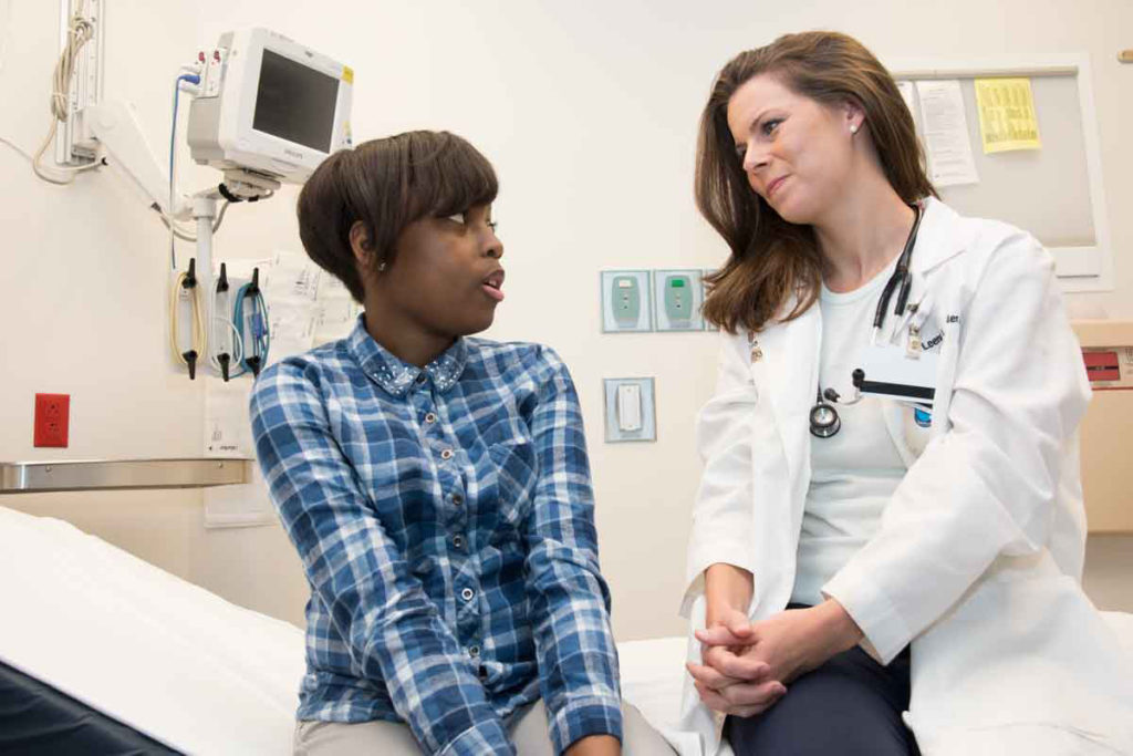 young patient talks with doctor
