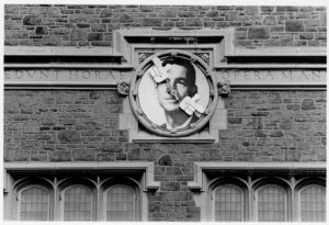 Chancellor William H. Danforth's picture on clock in Brookings Quadrangle (Washington University Archives)