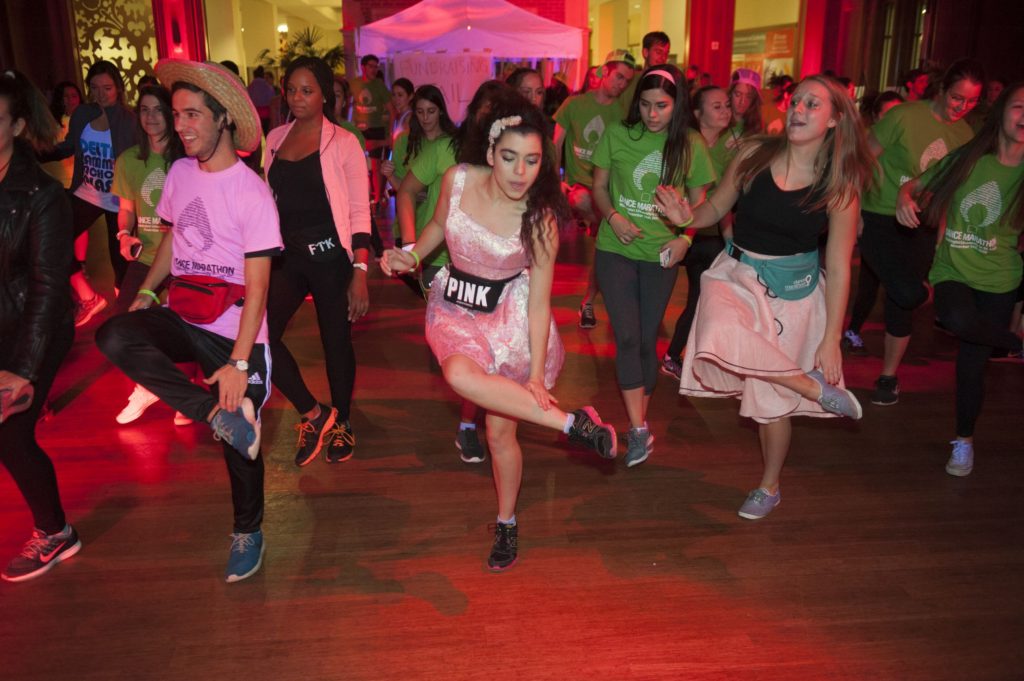 Students from Washington University in St. Louis were joined by faculty and administrators for the 2015 Dance Marathon, a fundraiser for the Children's Miracle Network Hospitals of St. Louis, at Tisch Commons in the Danforth University Center in St. Louis. WUSTL students David D'Agrosa (left), Jordan Sligar and Stacy Curnow. Photo by Sid Hastings / WUSTL Photos