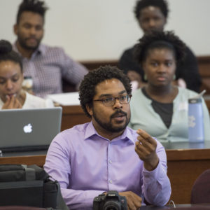 Jonathan Jackson (center), MA ’10, PhD ’14, an alumnus of the Chancellor’s Graduate Fellowship Program, studied psychological and brain sciences while at the university. He is currently an instructor at Harvard Medical School. (Photo: Joe Angeles)
