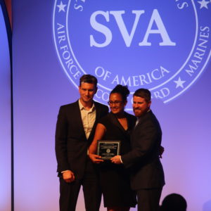 James Petersen and Jennifer Goetz of WUVets accept the Student Veterans of America Chapter of the Year award from SVA President and CEO Jared Lyon