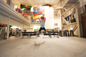 Staff member Seth Alms works out at Sumers every morning before work. He calls Bryan Lenz, director of recreational sports and campus fitness, and his staff “family.” Lenz calls Alms the university’s “American Ninja Warrior.” (Joe Angeles/Washington University)