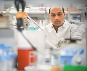 Siddarth Venkatesh, a postdoctoral fellow in Gordon’s lab, is using novel gnotobiotic animal models to develop a new class of therapeutic foods. These foods are designed to repair the disordered maturation of the gut microbiota that occurs in children with undernutrition. (James Byard)