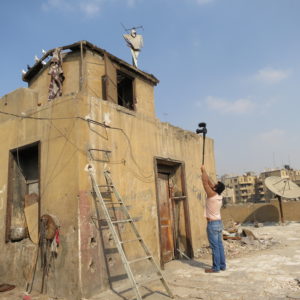 Taksler hired a local crew to help her film Tickling Giants. Here, a cameraman films in Cairo, Egypt.