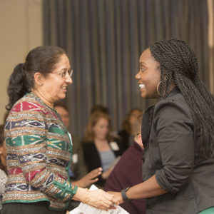 two people share a happy moment at the annual Faculty and Staff Awards