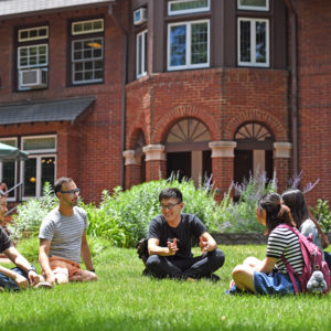 students on lawn outside Stix House
