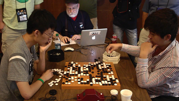 Competitors in the game of Go