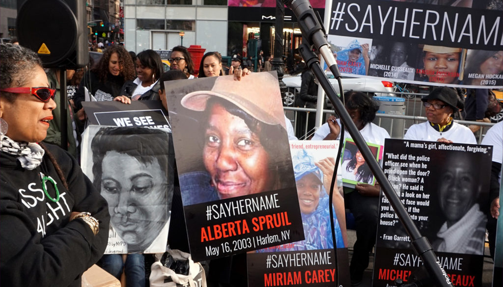“Say her name” posters on display May 20, 2015, at a New York City vigil for black women and girls killed by the police. Photo courtesy of All-Nite Images via Wikipedia Commons.