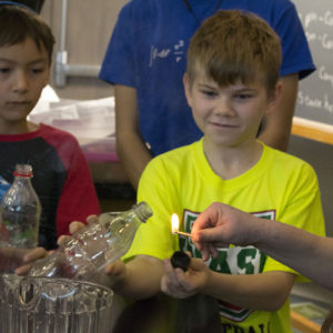 Children doing a physics experiment