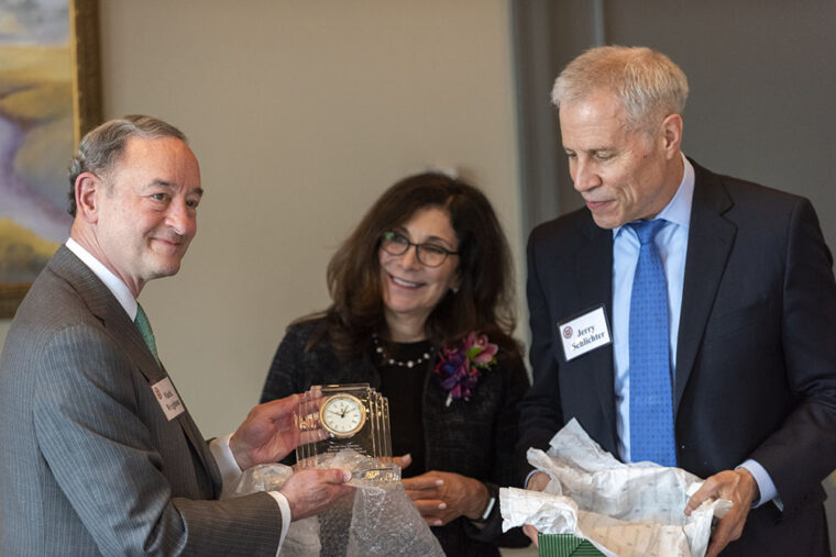 Chancellor Mark S. Wrighton (left) presents the 2019 Jane and Whitney Harris St. Louis Community Service Award to Sue and Jerry Schlichter during a March 29 luncheon at the Saint Louis Club. (Photo: Sid Hastings/Washington University)