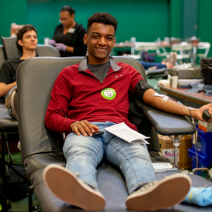student donates blood