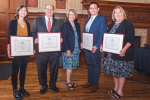 Receiving awards from Dean Barbara A. Schaal (center) are (from left) Rachel Dunaway, Henry S. Webber, Robert Chien and Sue McKinney.