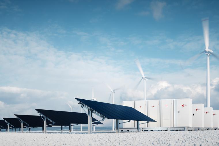 Solar panels, wind turbines and large, white storage boxes symbolizing high-capacity energy storage .