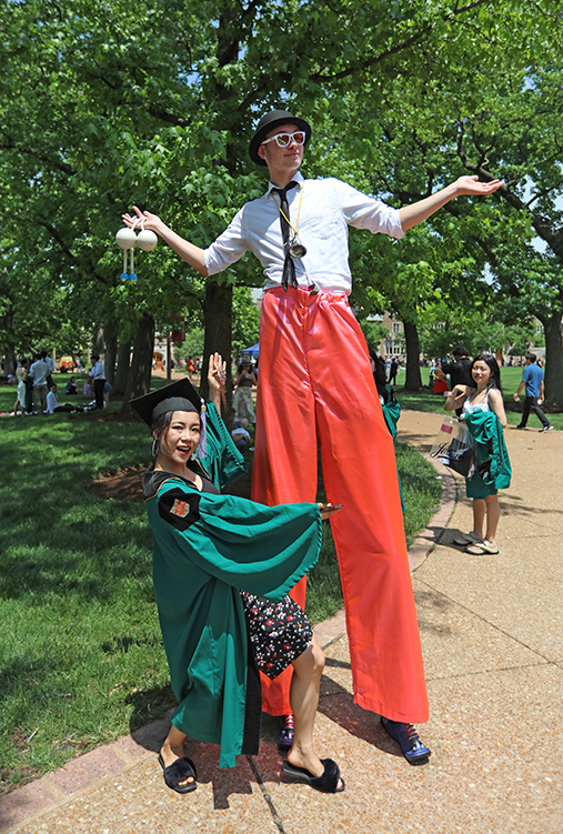 A circus performer on stilts was one of the first to greet the Class of 2022 at the campus-wide festival of celebration following Commencement.