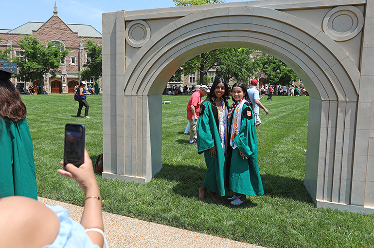 There's no substitute for the real thing, but a temporary Brookings Archway was one of the photo opportunities available to the graduates following the ceremony.
