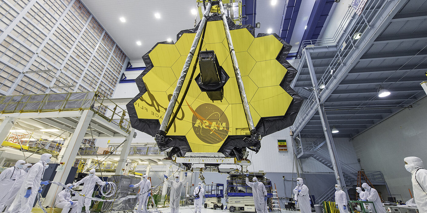 The deployed primary mirror of the James Webb Space Telescope looks like a spring flower in full bloom.