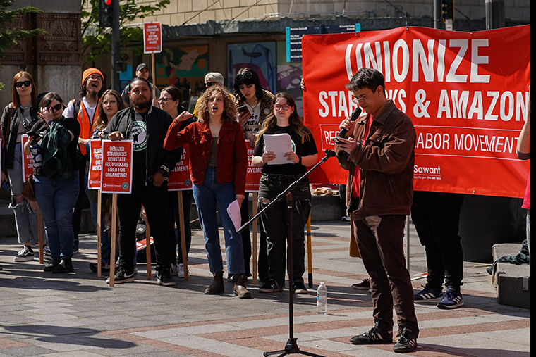 Activists march at the Starbucks Worker Solidarity Rally in support of unionization for baristas and other retail workers in Seattle in April 2022.