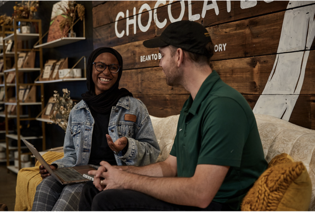 Sophomore Aisha Adedayo consults with Honeymoon Chocolates founder Cam Loyet.