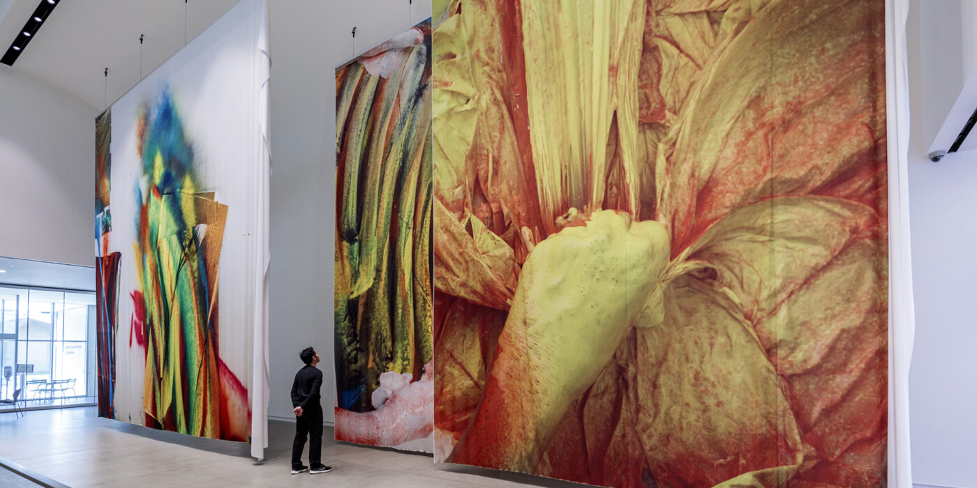 For her exhibition at the Mildred Lane Kemper Art Museum, German artist Katharina Grosse created three large fabric pieces, each measuring more than 20 feet tall, for the Saligman Family Atrium. The pieces feature digitally manipulated photographs of Grosse’s workspace and painting process. (Photo: Joshua White/JWPictures.com)