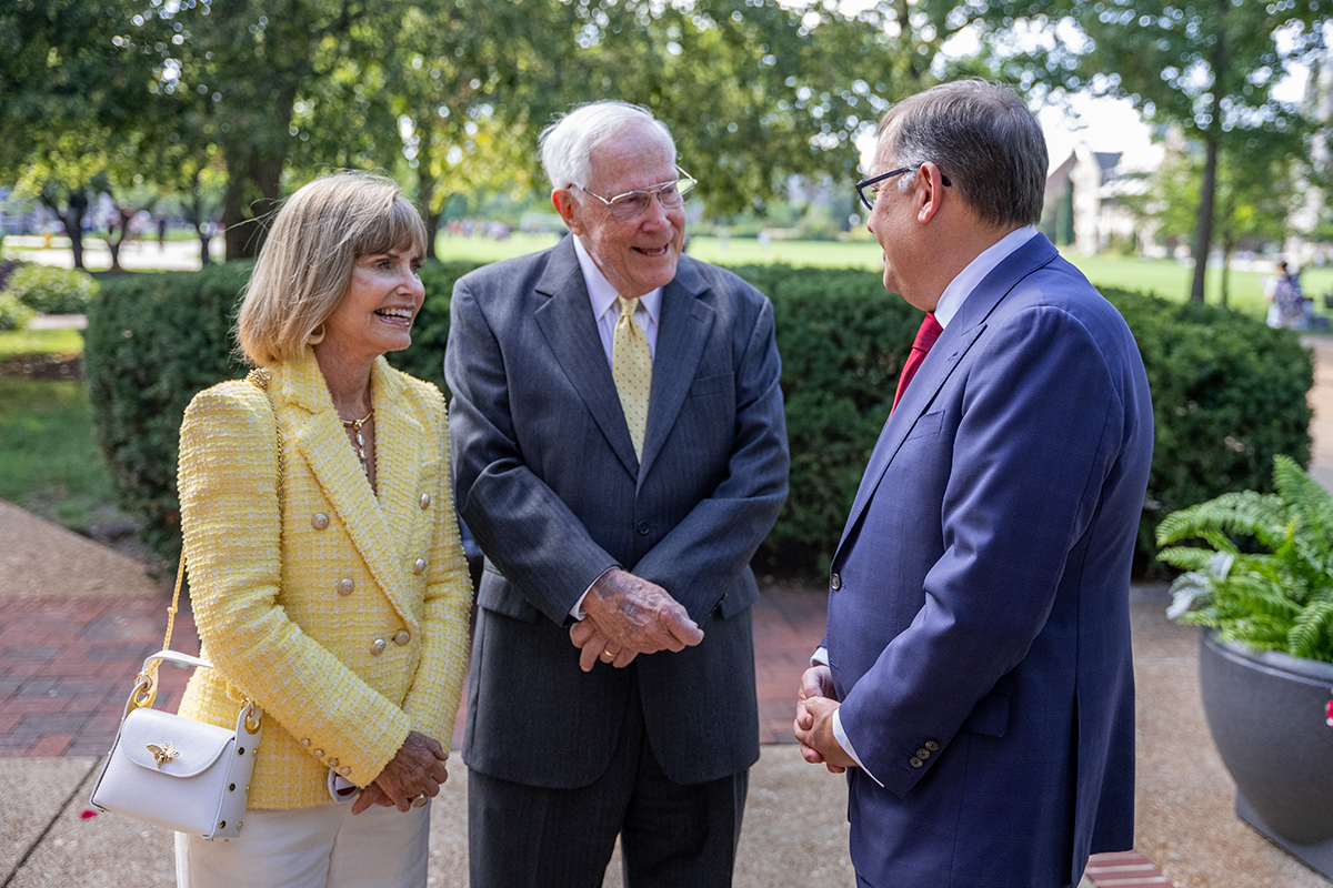 Chancellor Andrew D. Martin visits with donors Diane and Dick Engelsmann