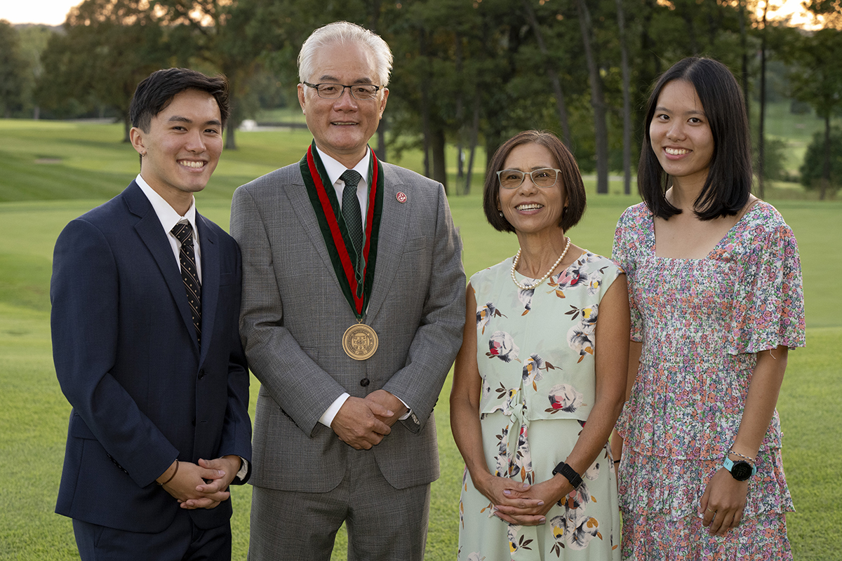 Feng Sheng Hu with his family, son, Brooks Hu; wife, Sumi Yoneji; and daughter, Cadi Hu