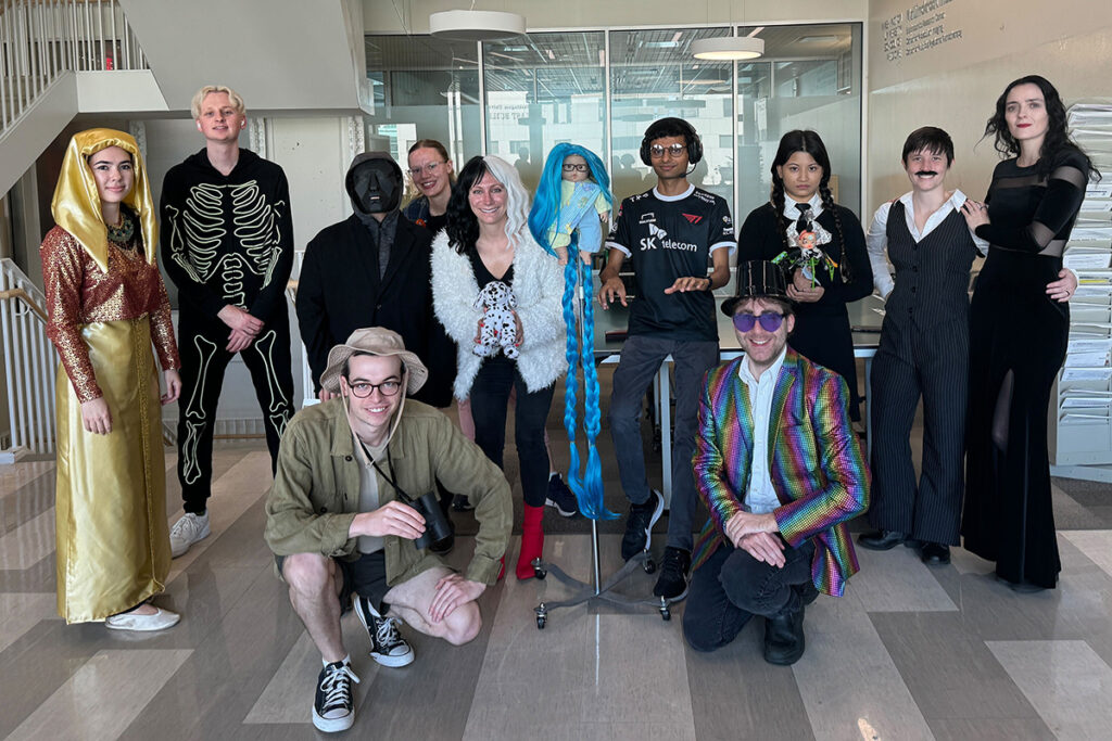 medical school lab members in Halloween costumes