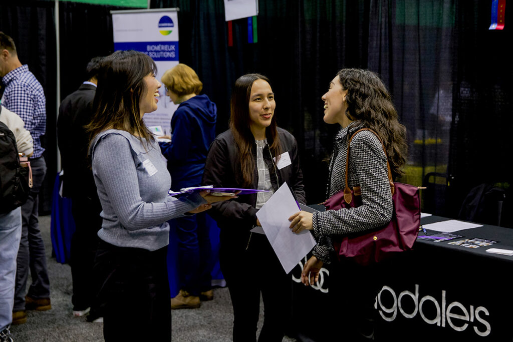 Students meet with a potential employer at the WashU career fair