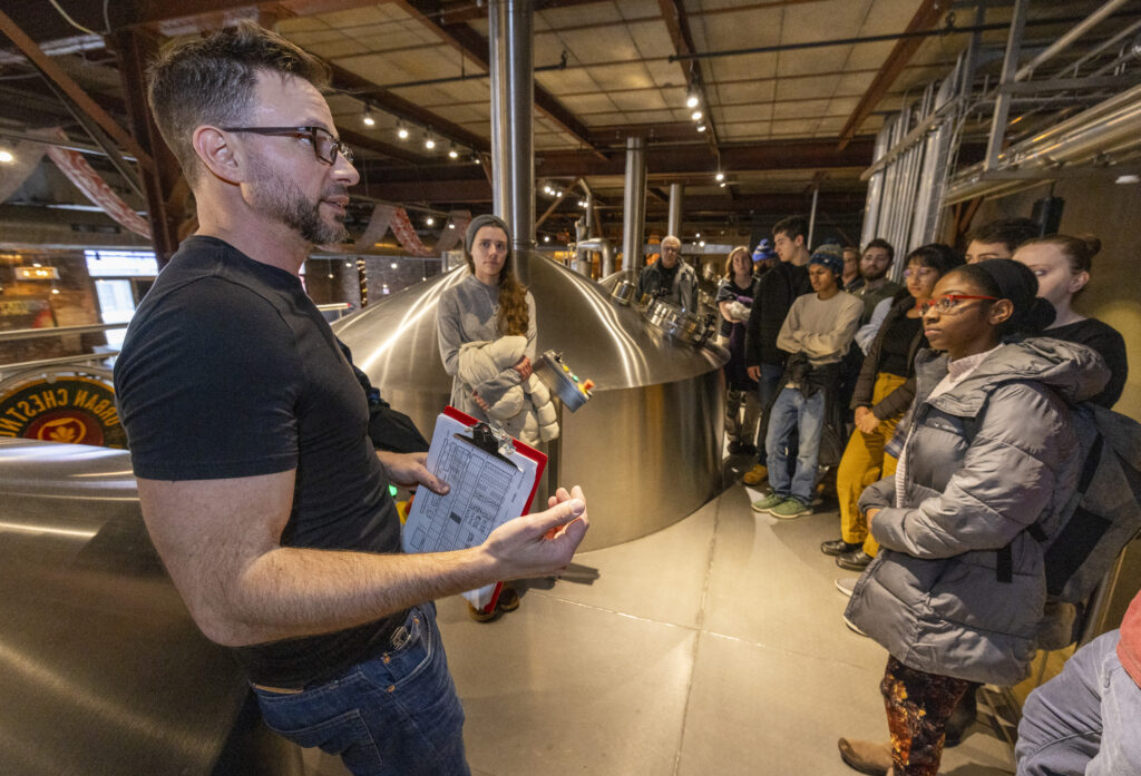Kurt Driesner of Urban Chestnut brewery gives Washington University engineering students a tour of the brewing kettles.