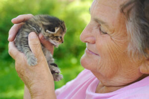 older woman with a kitten