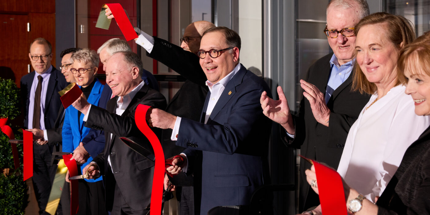 Chancellor Andrew Martin (center) celebrates the dedication of the Jeffrey T. Fort Neuroscience Research Building after cutting the ribbon with WashU leaders and friends, including Jeffrey T. Fort and Fort’s sister, Liz Dorr (both right of Chancellor Martin), Jan. 18. (Photo: Matt Miller)