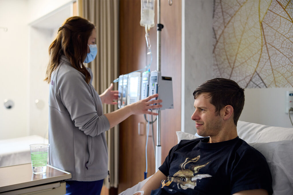 On Jan. 24, Ryan Redshaw received his first infusion from Kathryn Schubert, a Clinical and Translational Research Unit staff nurse, as part of the Tau NexGen clinical trial. (Matt Miller/Washington University School of Medicine)