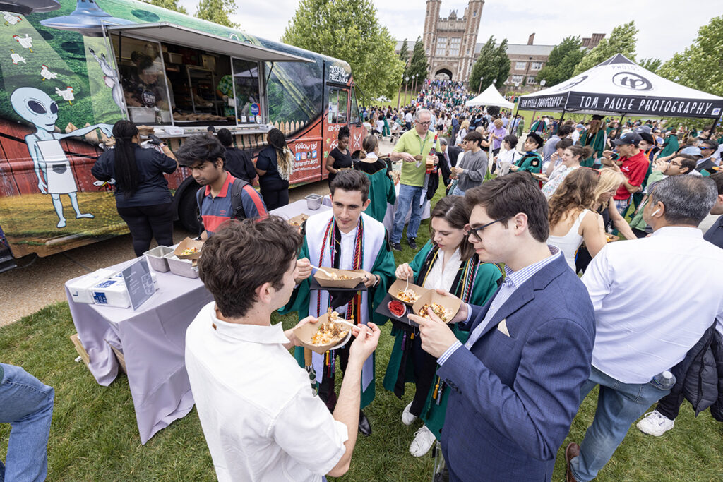 Graduates enjoy food at the Commencement festival