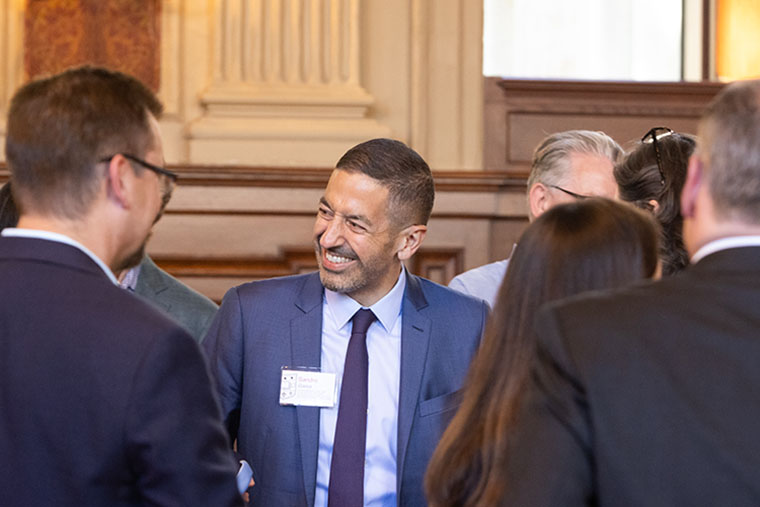 Sandro Galea, MD, DrPh, greets members of the WashU community during a welcome event.